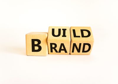 letter blocks spelling "build brand"