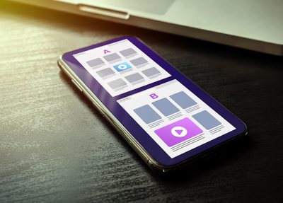 smart phone on a desk displaying an a/b test