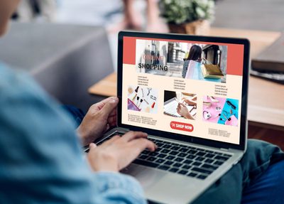 A person optimizing Amazon content for sales on a laptop