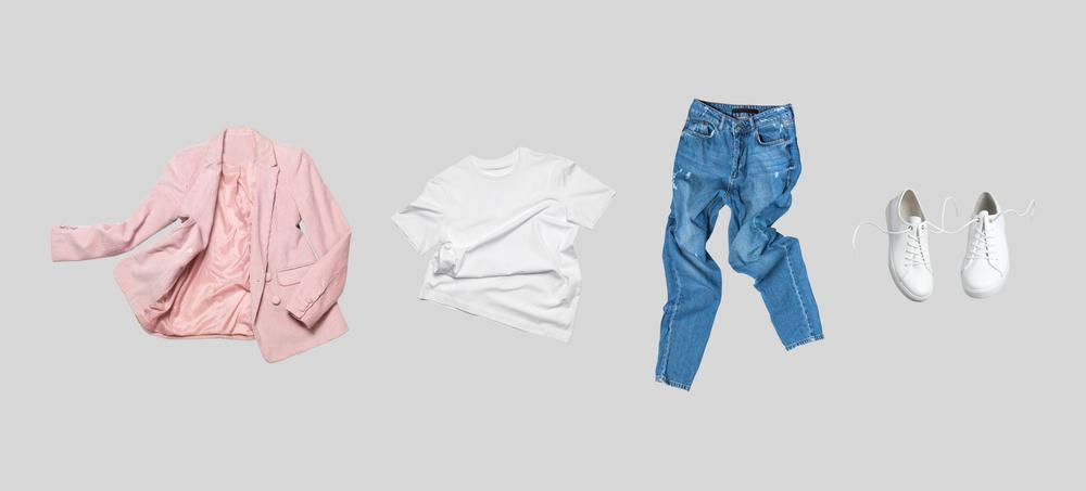 A pink jacket, a pair of jeans, and white sneakers