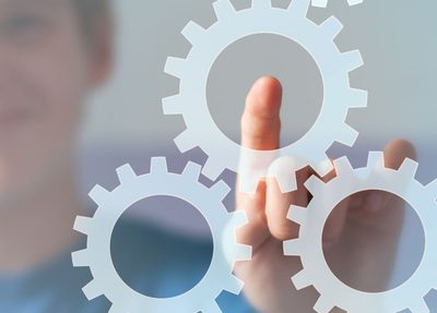 a man pointing to settings gear icons