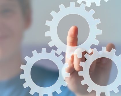 a man pointing to settings gear icons