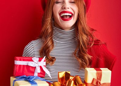 smiling woman holding gifts