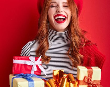 smiling woman holding gifts