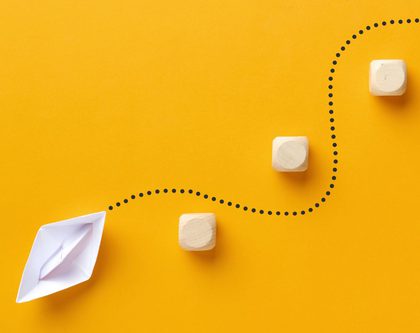 A white paper ship on yellow background navigating Amazon DSP challenges