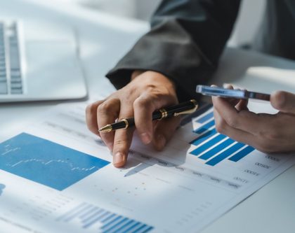a person pointing to a graph