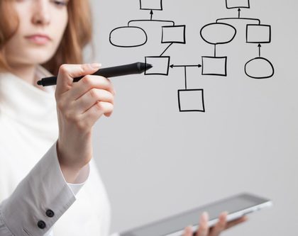 a woman with a tablet in hand shows a diagram