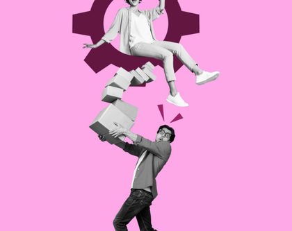 a man and woman are united in holding a gear wheel