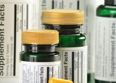 vitamins + bottles showing supplement facts