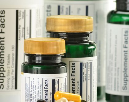 vitamins + bottles showing supplement facts