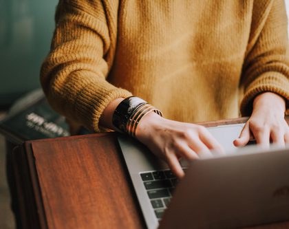 A woman working on a computer for an advertising agency