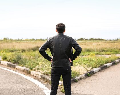 A man standing at a crossroad
