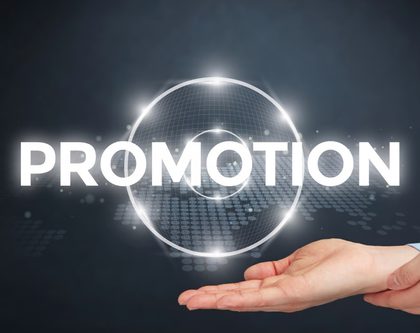a hand holding promotion sign
