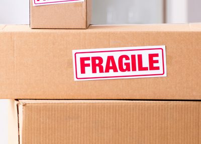 a set of cardboard boxes with word fragile on them