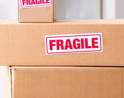 a set of cardboard boxes with word fragile on them