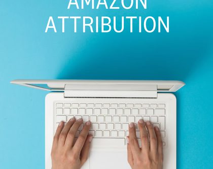 A person working on Amazon Attribution on a computer