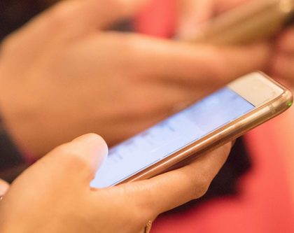 woman-on-phone-reading-text-message
