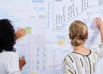 two-women-working-on-strategy