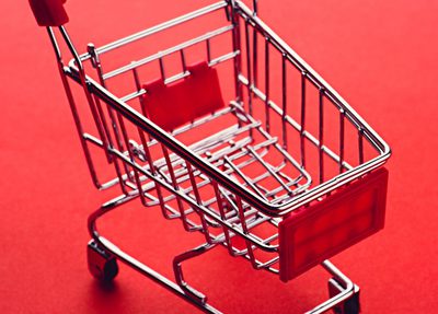A shopping cart on a red background