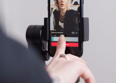 woman-recording-on-cell-phone