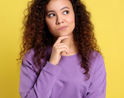 an image of a girl with long curly hair thinking about why more is not always better online