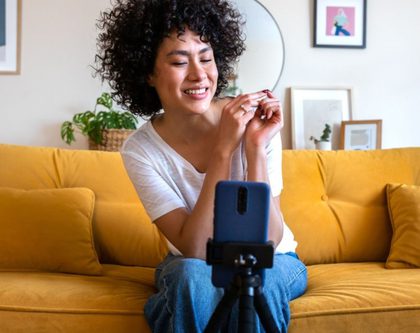 an influencer setting up a tripod with a phone for video recording