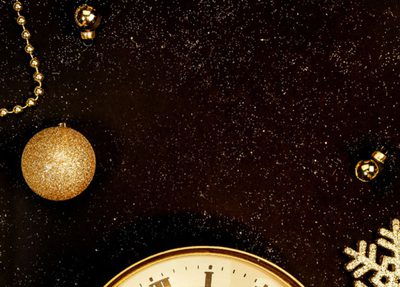 a clock in a holiday/winter themed background