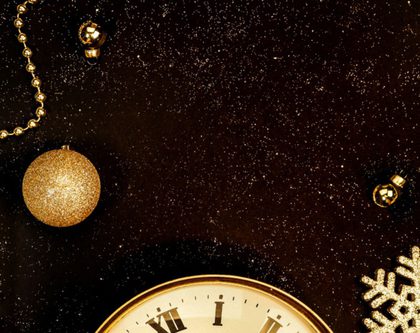 a clock in a holiday/winter themed background