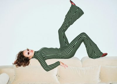women in green stripes and sunglasses